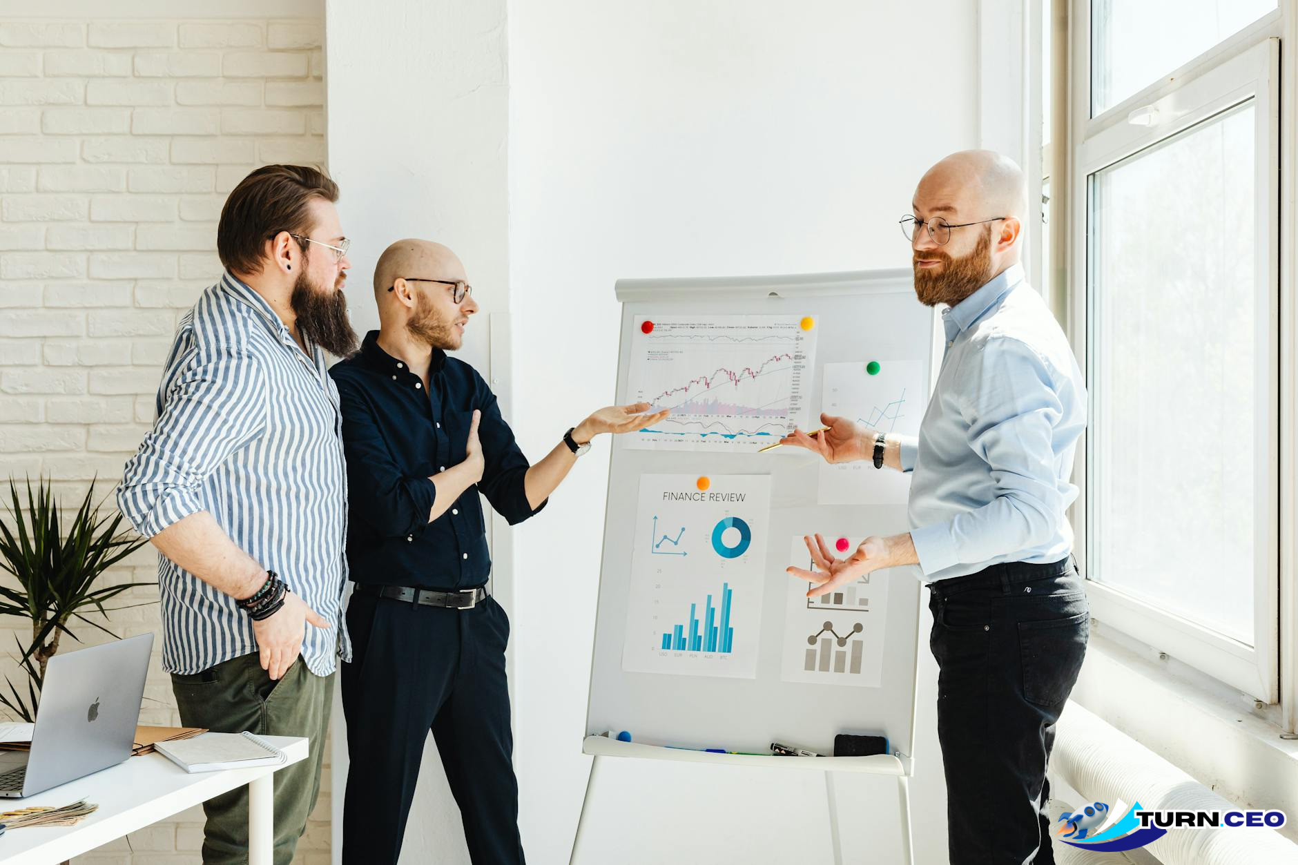business meeting with charts and graphs on whiteboard showing real metrics