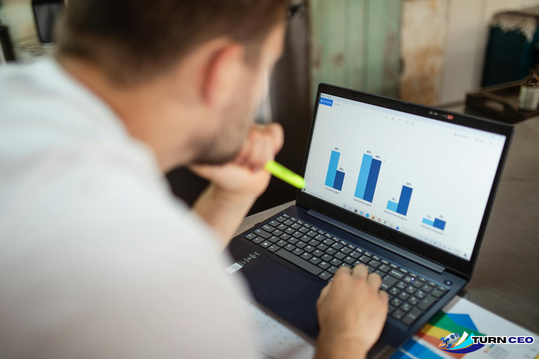 business executive looking at charts and data on laptop screen