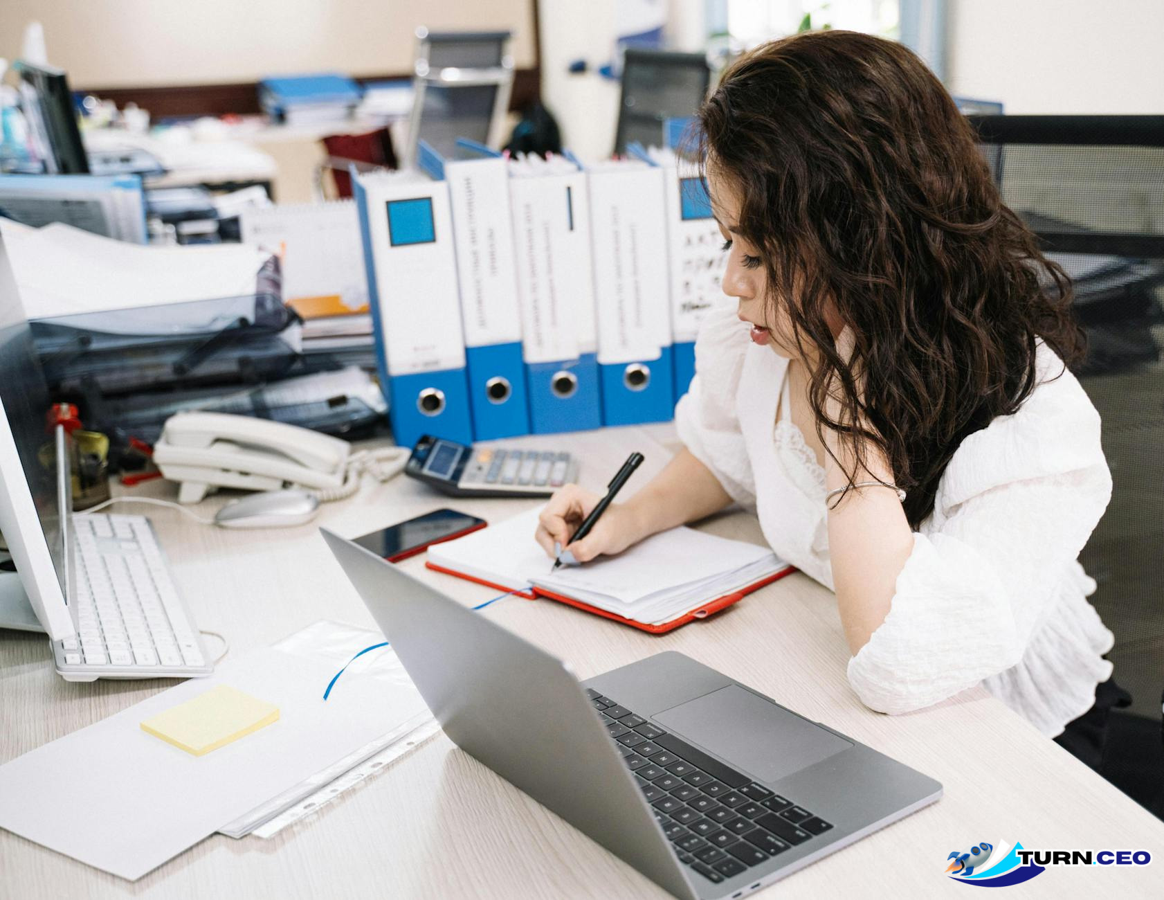 business owner surrounded by multiple tasks and responsibilities