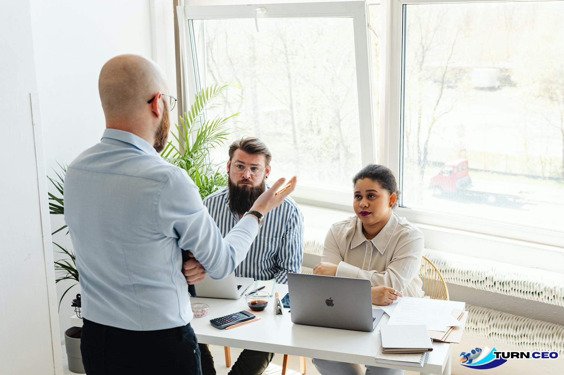 Business team meeting with CEO leading strategic discussion